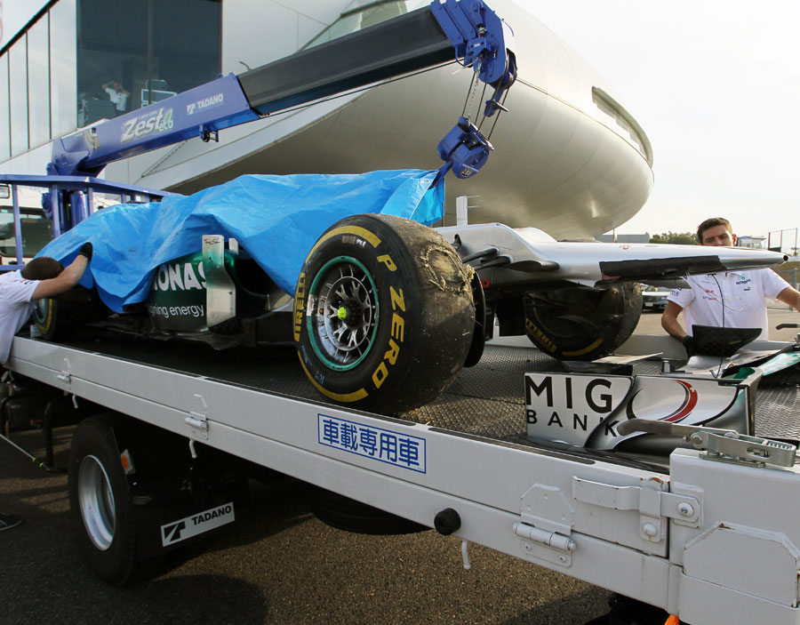 Michael Schumacher's Mercedes is returned to the pits