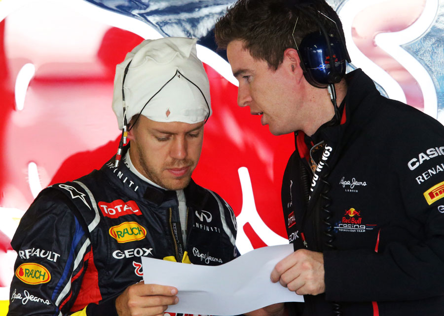 Sebastian Vettel studies data in the Red Bull garage