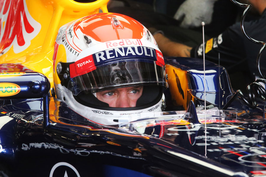 Sebastian Vettel waits patiently in the Red Bull garage