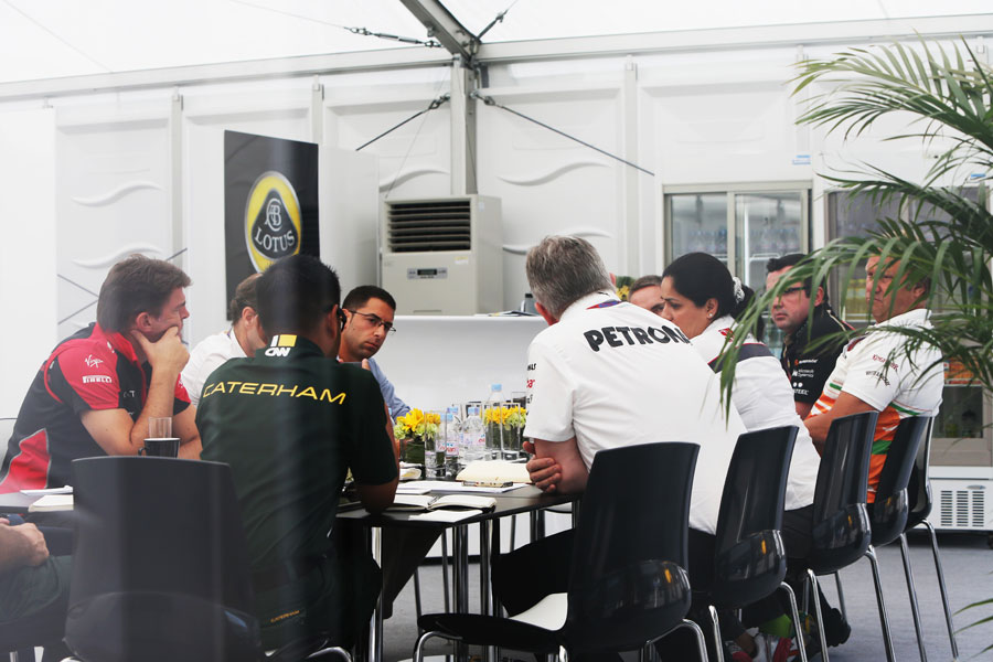 A meeting of team principals in the Lotus motorhome