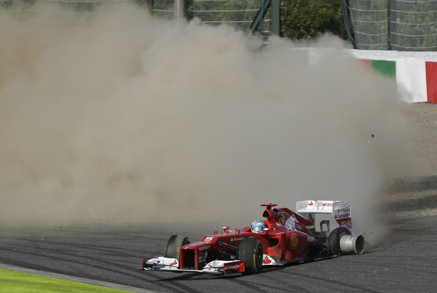 Fernando Alonso spins to a halt at the first corner