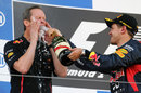 Sebastian Vettel sprays champagne over head of car engineering Paul Monaghan
