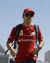 Felipe Massa walks through the paddock
