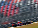 Sebastian Vettel blasts past empty grandstands during Friday practice