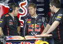 Sebastian Vettel discusses set-up with his engineers
