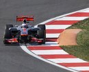 Jenson Button attacks the final corner with his DRS open