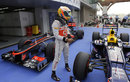 Lewis Hamilton takes a look at the Red Bull RB8 in parc ferme