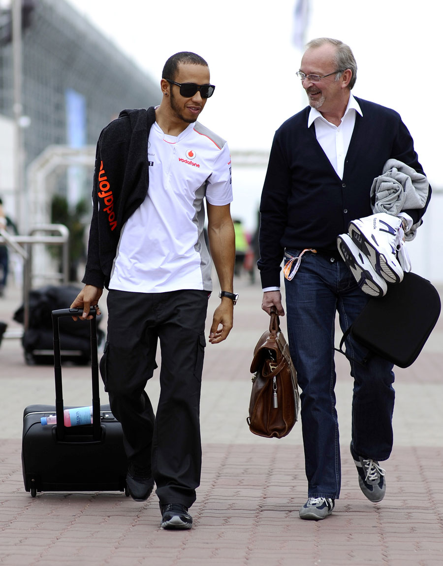 Lewis Hamilton arrives in the paddock with his manager Didier Coton