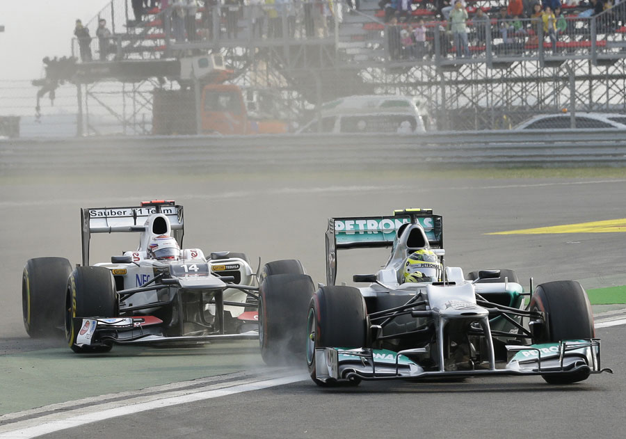 Nico Rosberg and Kamui Kobayashi rejoin the track after running wide