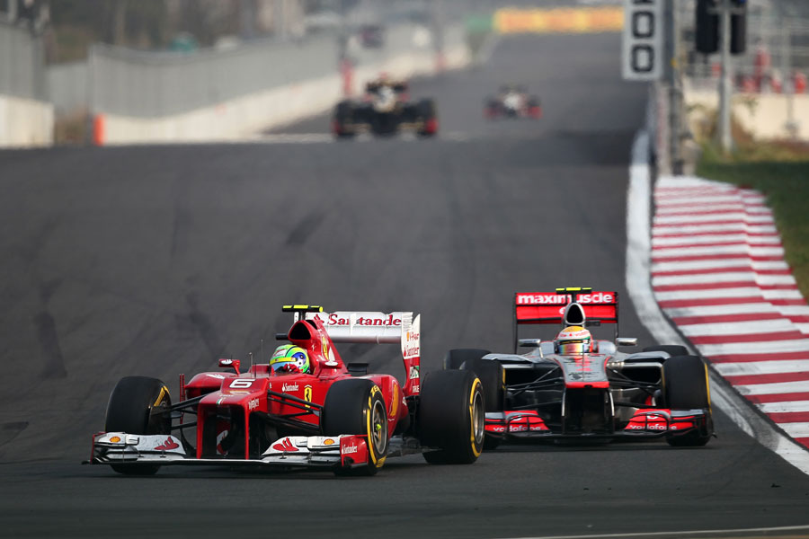 Felipe Massa leads Lewis Hamilton into turn three