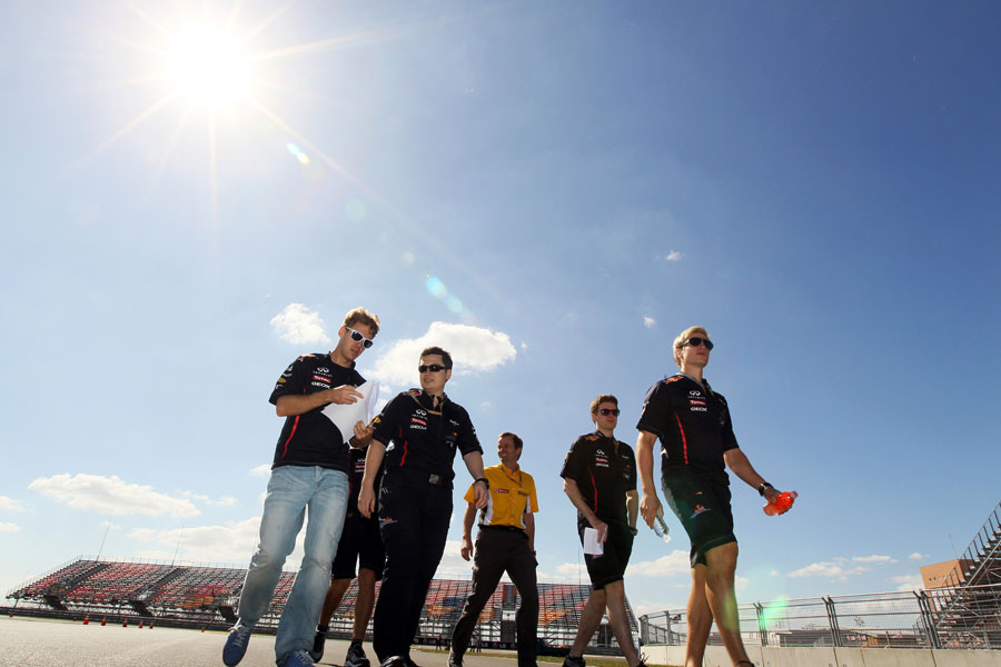 Sebastian Vettel walks the track with his team