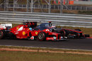 Fernando Alonso and Jenson Button vie for position on track