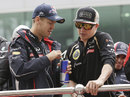 Kimi Raikkonen and Sebastian Vettel chat on the driver parade