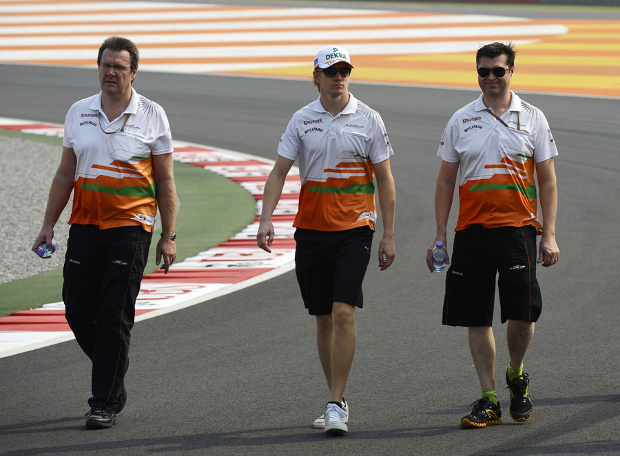 Nico Hulkenberg walks the track with his engineers