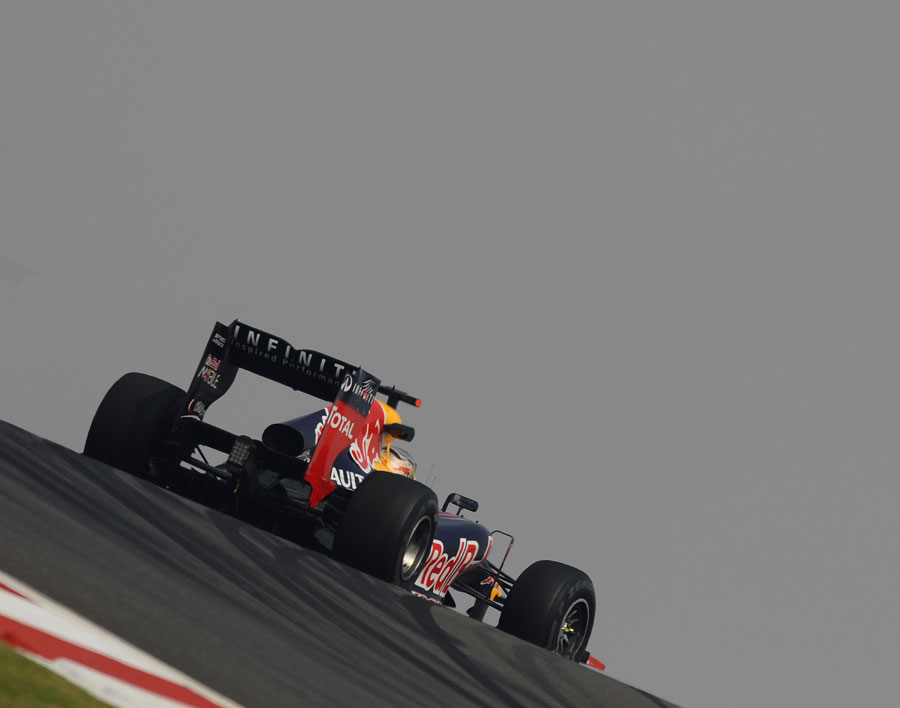 Sebastian Vettel crests turn three