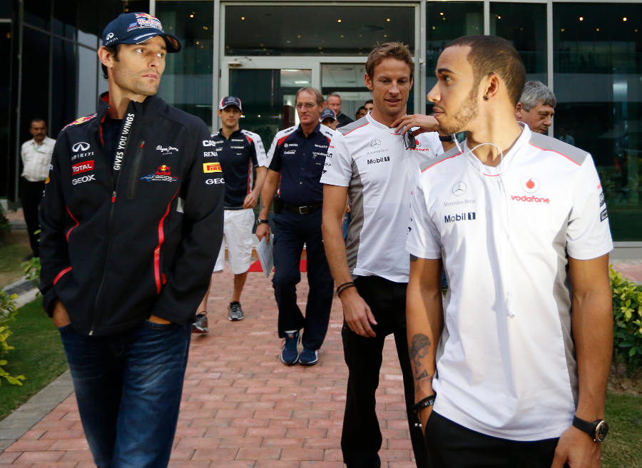 Mark Webber, Lewis Hamilton and Jenson Button leave the driver briefing