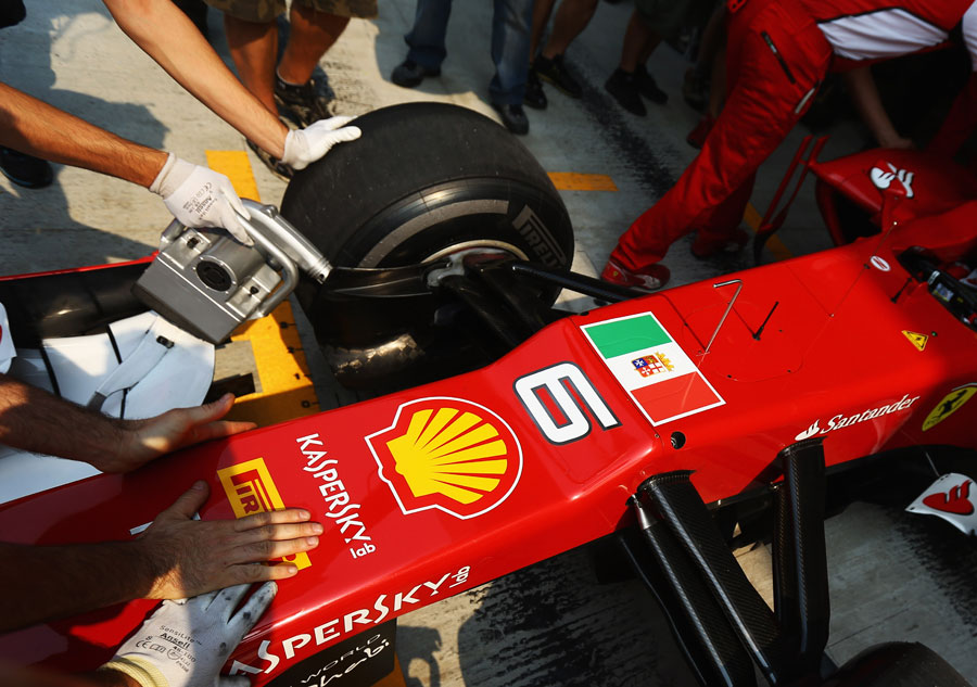 The Italian naval flag on the front of Felipe Massa's car in final practice