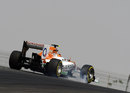 Nico Hulkenberg locks a wheel in his Force India