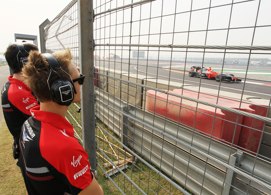 Max Chilton watches Timo Glock on track