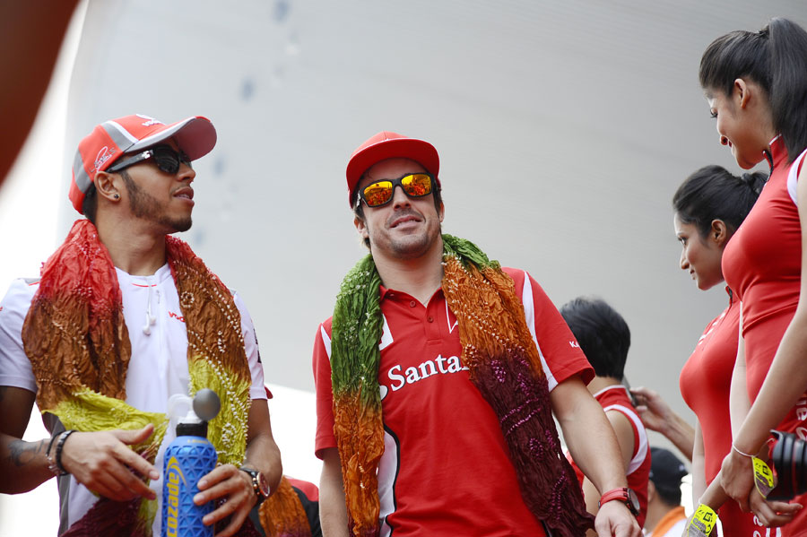 Lewis Hamilton and Fernando Alonso on the way to the drivers' parade