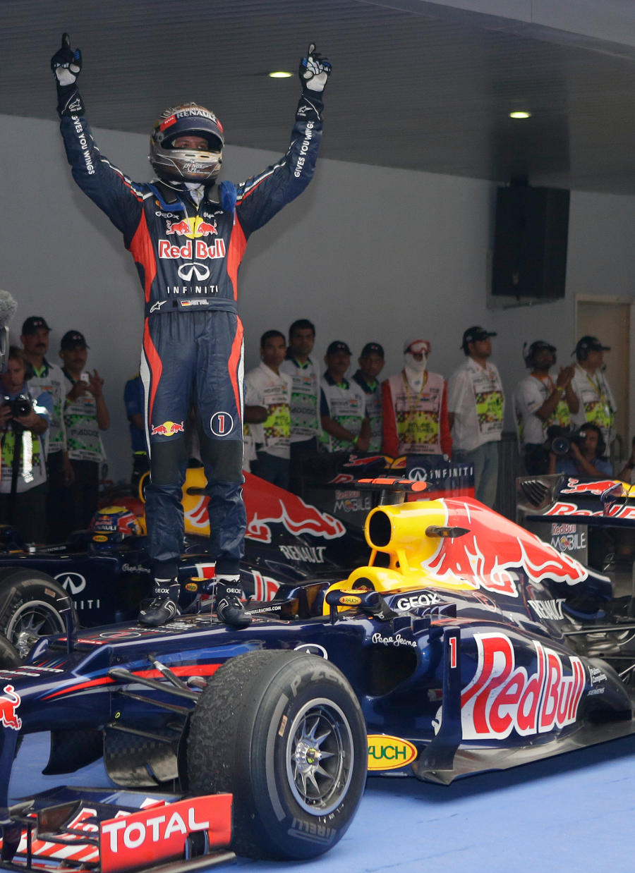 Sebastian Vettel celebrates his victory in parc ferme