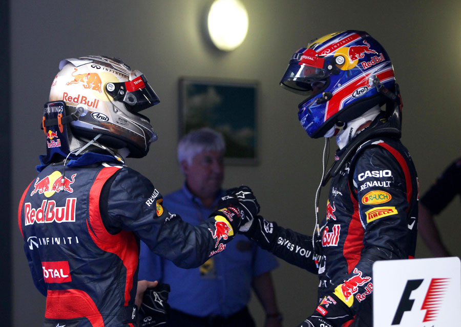 Mark Webber congratulates Sebastian Vettel on victory