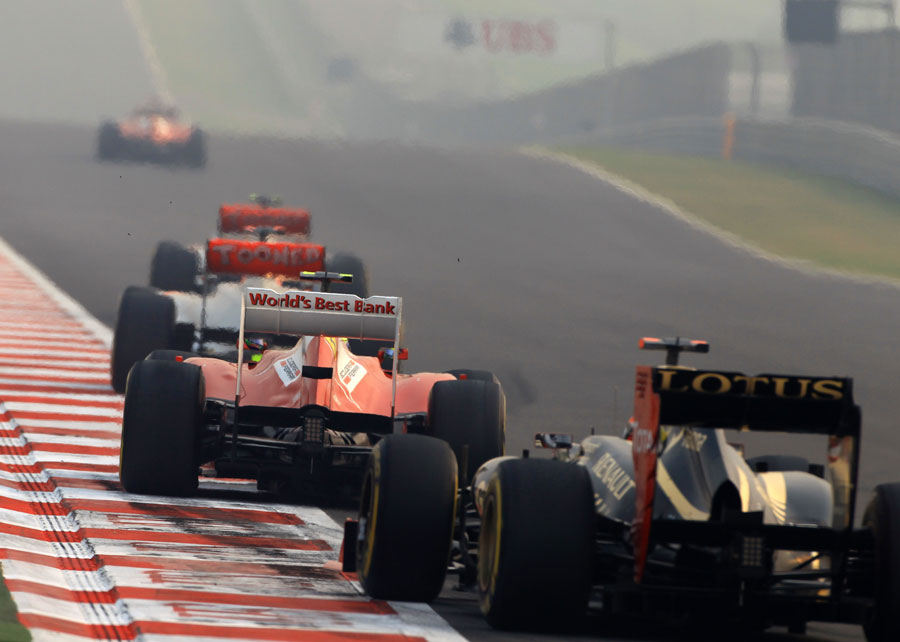 The McLarens, Felipe Massa and Kimi Raikkonen exit turn three