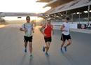 Jenson Button runs Dubai Autodrome with his trainer Mike Collier and Richard Williams