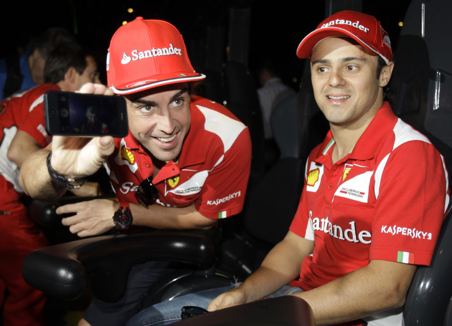 Fernando Alonso and Felipe Massa lark about at the Ferrari World entertainment park in Abu Dhabi