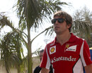 Fernando Alonso walks through the paddock on Thursday