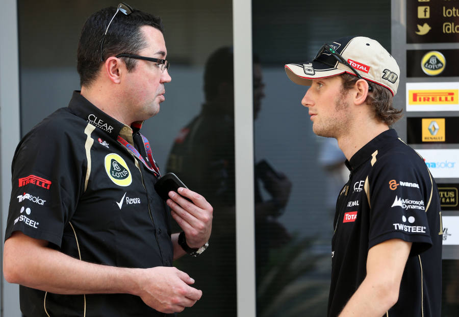 Romain Grosjean and Eric Boullier chat in the pit lane