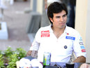 Sergio Perez sits outside Sauber's hospitality 