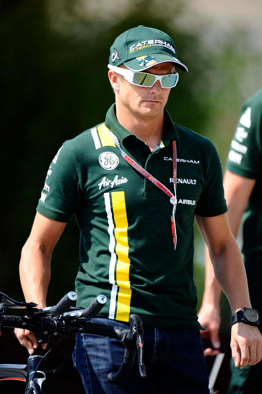 Heikki Kovalainen arrives in the paddock on Thursday morning