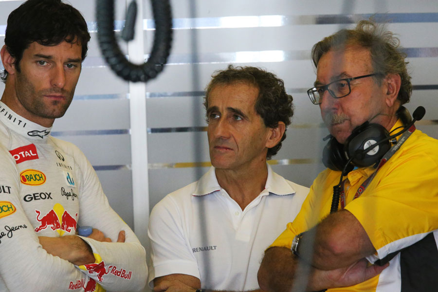Mark Webber talks to four-time champion Alain Prost and Renault Sport boss Jean-Francois Caubet between practice runs