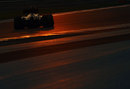 Kimi Raikkonen on track as the sun goes down