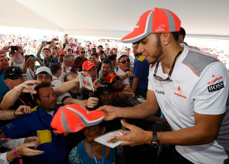 Lewis Hamilton signs autographs on Saturday morning