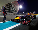 Sebastian Vettel stands by his stricken Red Bull after it race out of fuel in Q3