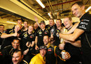 Kimi Raikkonen and his Lotus team celebrate victory