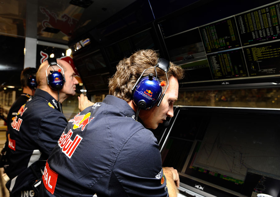 The Red Bull pit wall monitors Sebastian Vettel's progress through the field
