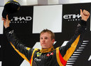 Kimi Raikkonen celebrates victory on the podium
