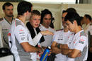 Kevin Magnussen talks to Gary Paffett and the McLaren engineers