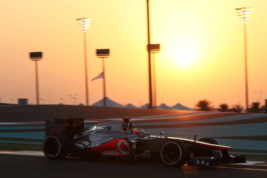 Jenson Button as the sun sets during FP2