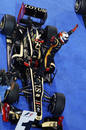 Kimi Raikkonen celebrates on top of his Lotus