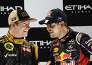 Kimi Raikkonen and Sebastian Vettel share a joke on the podium