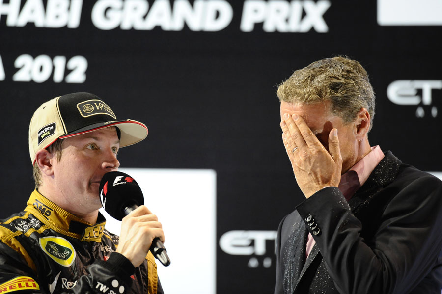 Kimi Raikkonen speaks to David Coulthard on the podium