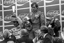 Carlos Reutemann in sombre mood on the podium