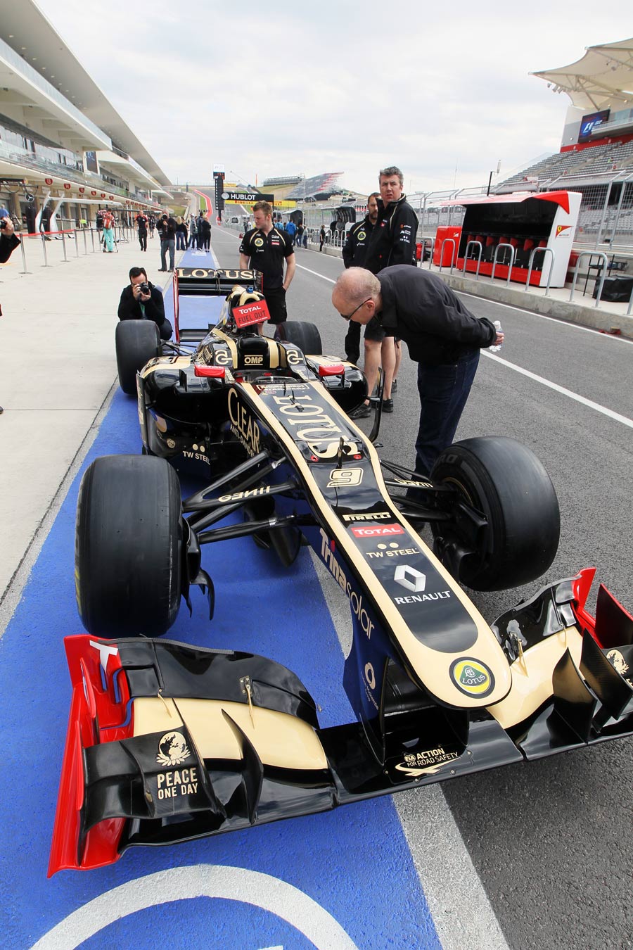 The Lotus E20 is pushed down the pitlane in Austin