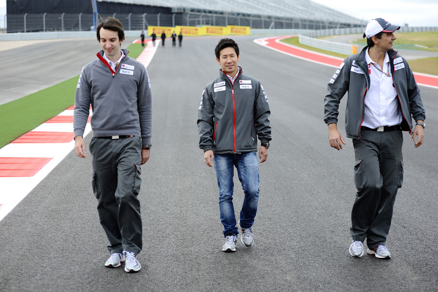 Kamui Kobayashi walks the track with his engineer