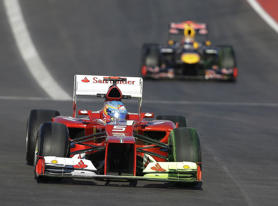 Fernando Alonso leads Sebastian Vettel on track