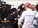 Jenson Button speaks to the press after dropping out of qualifying in Q2